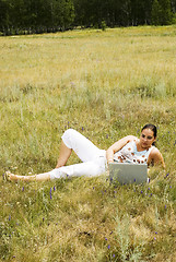 Image showing woman on the grass with laptop