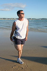 Image showing Stretching Exercises On The Beach