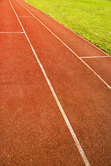 Image showing green grass and running track