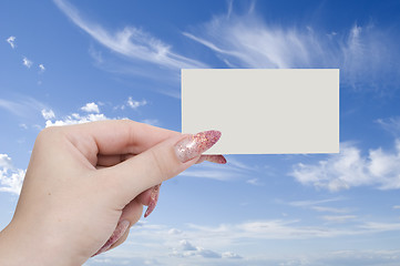 Image showing card in a hand on sky background