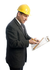 Image showing excited contractor with clipboard