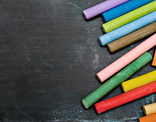 Image showing blackboard with coloured crayons