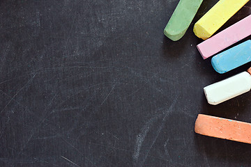 Image showing blackboard with coloured crayons