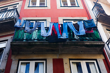 Image showing Jeans dried on a balcony