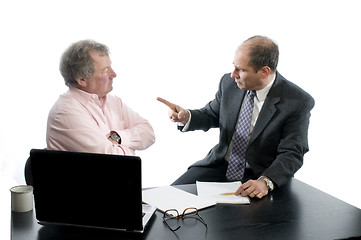 Image showing two business partners at desk shaking hands