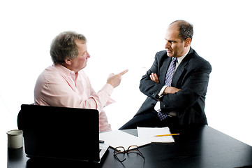 Image showing two business partners at desk shaking hands