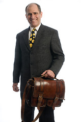 Image showing happy smiling business executive with leather attache travel bag