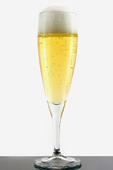 Image showing Champagne in glass on gray surface