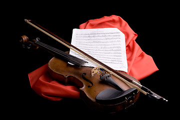 Image showing violin on scarlet silk