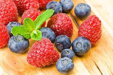 Image showing Blueberry, ruspberry and mint leaves