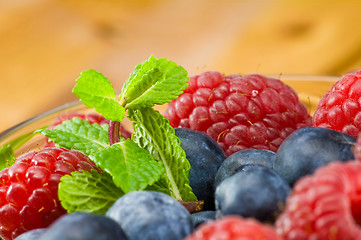 Image showing Blueberry, ruspberry and mint leaves