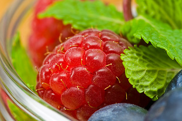 Image showing Blueberry, ruspberry and mint leaves