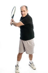 Image showing happy middle age man playing tennis