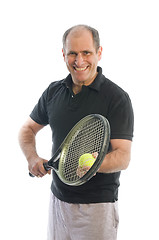 Image showing happy middle age man playing tennis
