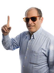 Image showing smiling man with finger pointing number one