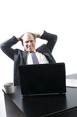 Image showing corporate business senior executive relaxing in office