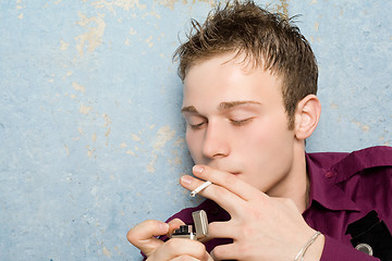 Image showing portrait of the young man with a cigarette