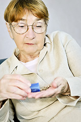 Image showing Elderly woman with medication