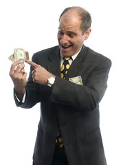 Image showing man middle age rolling in cash