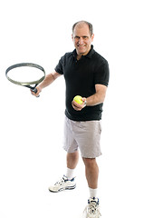 Image showing active senior man playing tennis with beer belly