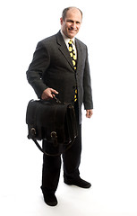 Image showing senior corporate executive traveling with leather bag