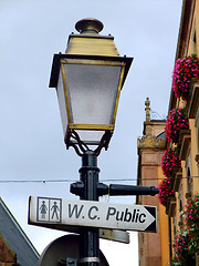 Image showing Street lamp with a sign for public toilets in France
