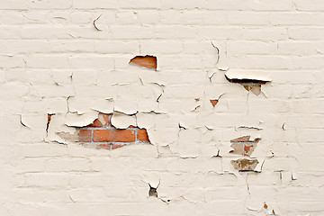 Image showing peeling paint over brick wall