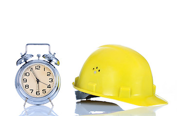 Image showing alarm clock and helmet 