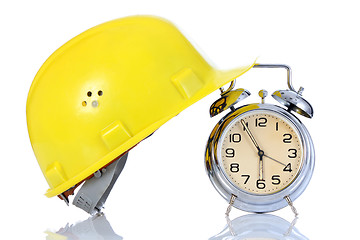 Image showing alarm clock and helmet 