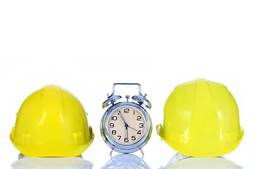 Image showing alarm clock and helmet 