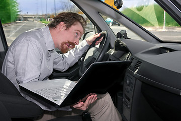 Image showing driver using GPS laptop
