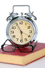 Image showing book with alarm clock and eyeglasses 