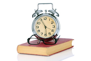 Image showing book with alarm clock and eyeglasses 