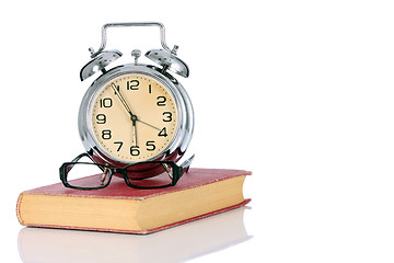 Image showing book with alarm clock and eyeglasses 