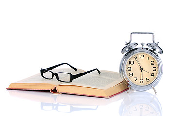 Image showing book with alarm clock and eyeglasses 