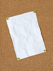 Image showing Crumpled paper pinned to corkboard