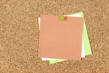 Image showing Colorful post-it notes pinned to corkboard