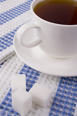 Image showing cup of tea and some sugar