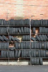 Image showing wall of tires, vertical