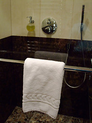 Image showing TOWEL HANGING IN A  shower