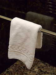 Image showing TOWEL HANGING IN A  BATHROOM