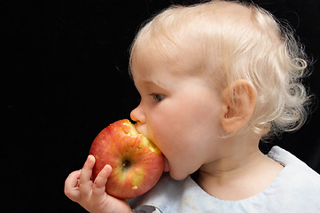 Image showing girl bitting apple