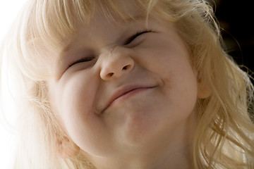 Image showing Girl makes faces