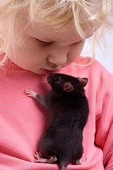 Image showing baby with rat