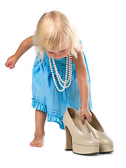Image showing little girl with big shoes