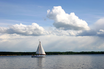 Image showing Recreation time. A family in the yacht is sailing