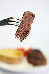 Image showing Piece of steak on a fork