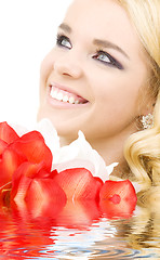 Image showing happy woman with lily flowers