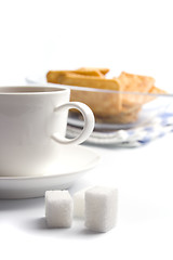 Image showing cup of tea, sugar and cookies