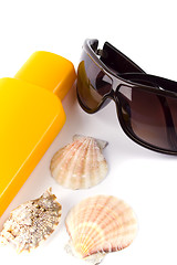 Image showing sunglasses and lotion